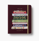 Maroon planner with book design and 'Rifle Paper Co.' branding on a white background